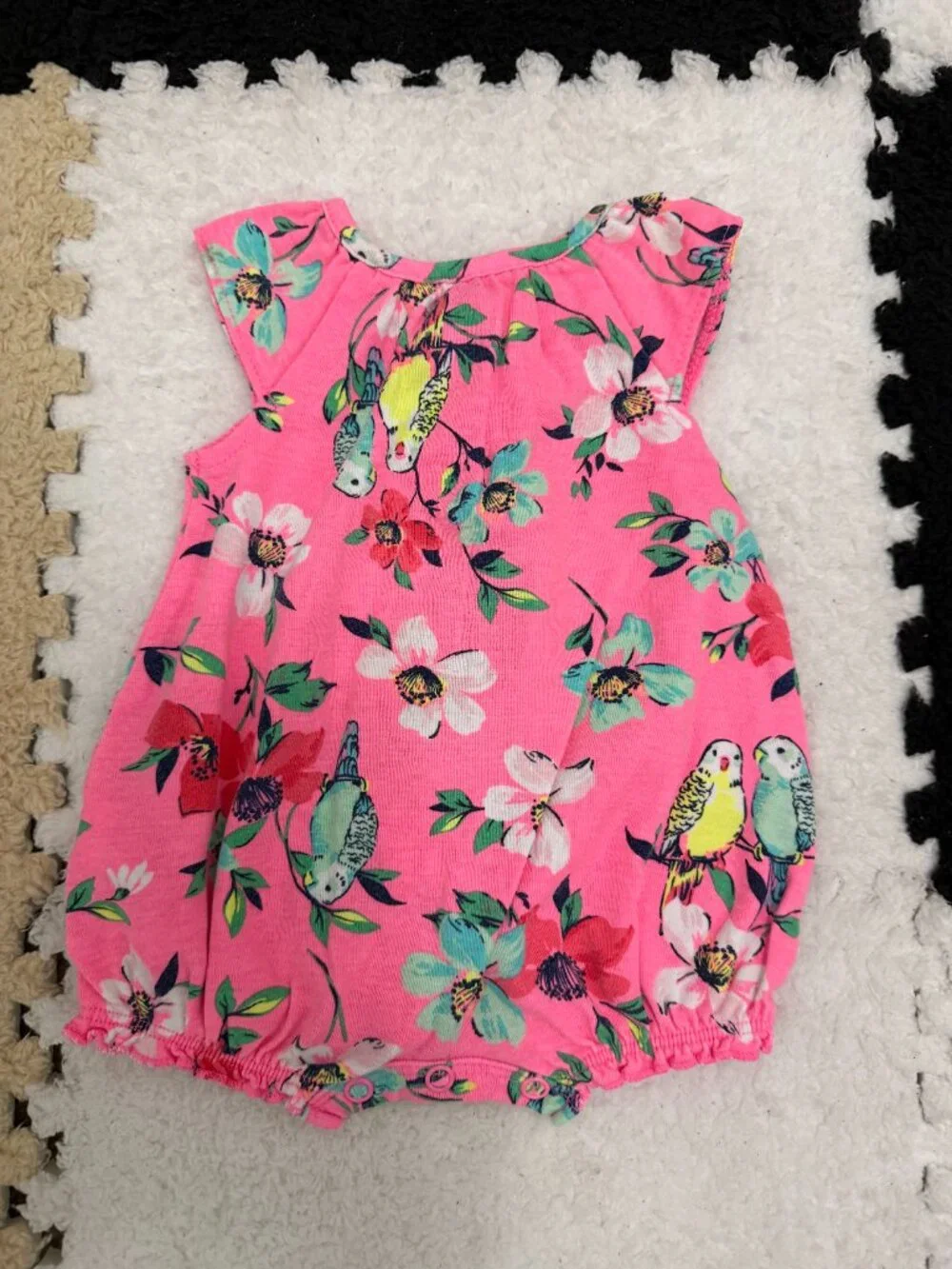 Carter’s NB pink onesie with flowers and little birds.
